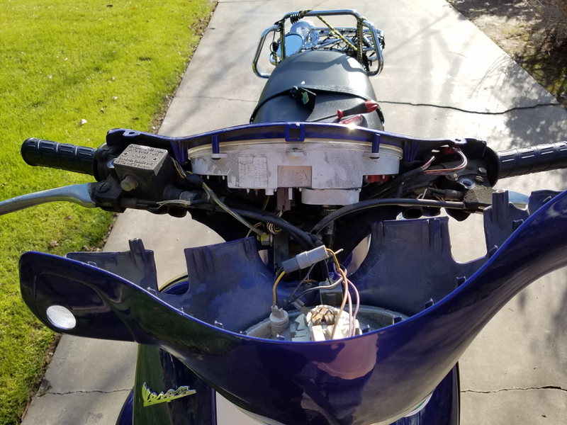 Open handlebar cover.